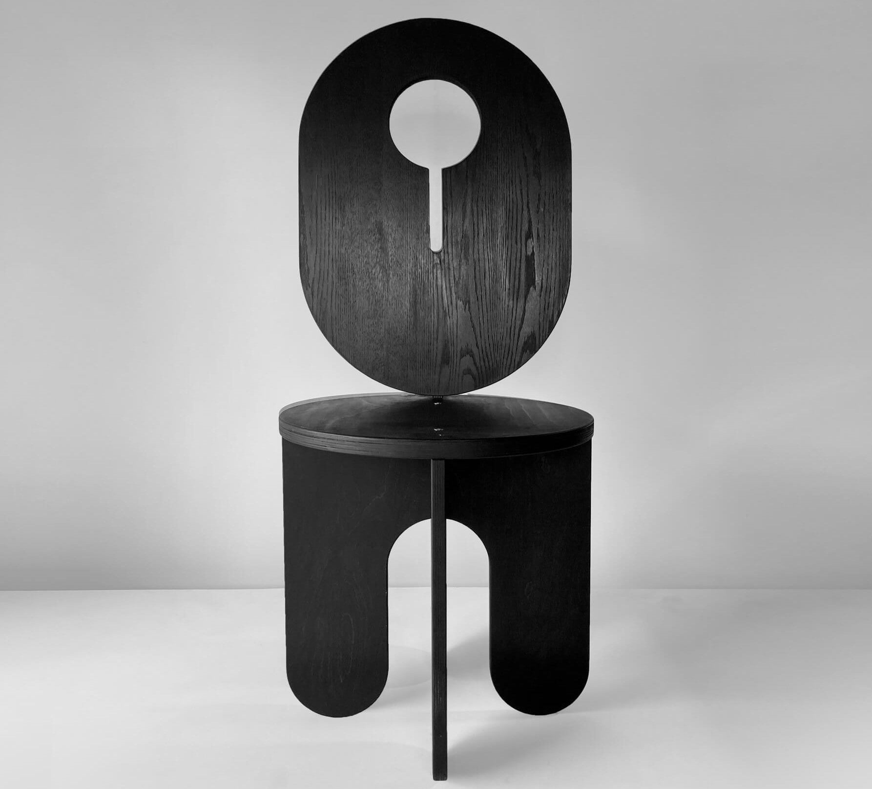 A black stool, named the Arata Stool. This piece was finished with Rubio Moncoat Precolor Easy and Oil Plus 2C.