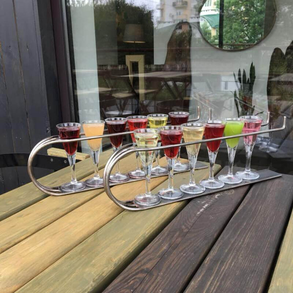 Multi-colored wood table on a patio outside of a restaurant.