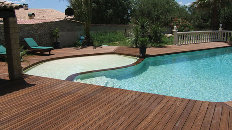 A pool and new Ipe wood deck finished with hardwax oil wood finish.