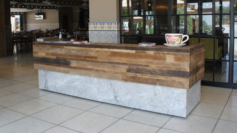 A counter made form concrete and rustic wood, finished with hardwax oil wood finish.
