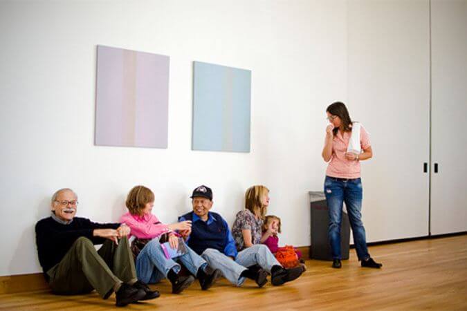 Folks enjoy a museum with hardwood floors finished with Rubio Monocoat.