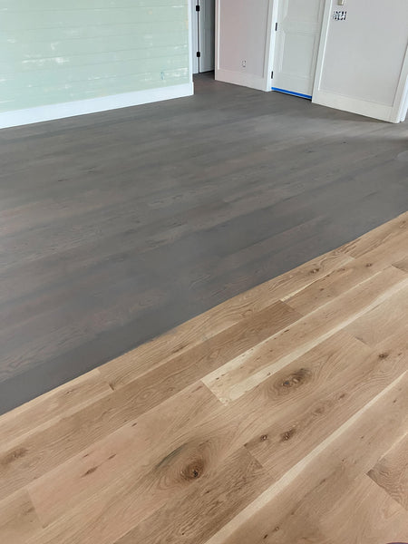 The start of a white oak floor being finished with Precolor Easy "Urban Grey".