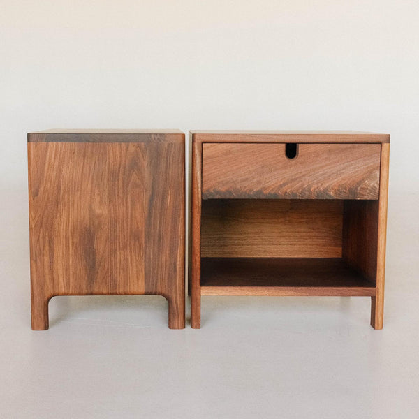 Two walnut side tables, one facing front and the other turned sideways. 