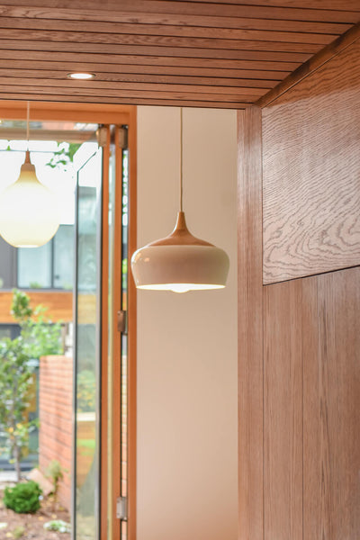 Light fixtures in a modern home with a variety of oak millwork finished with Rubio Monocoat Oil Plus 2C. 
