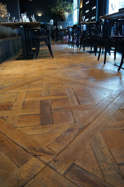 Details of wood flooring in restaurant finished with Rubio Monocoat.