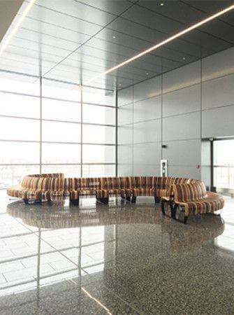 Winding wooden bench in Calgary International Airport finished with Rubio Monocoat Oil Plus 2C.