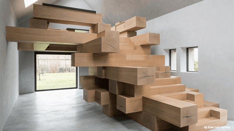 Life-like Jenga design from architect inside of office leading up to the upper office area.