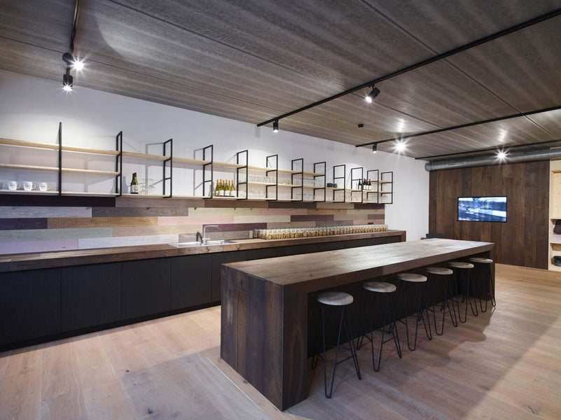 A counter with bar stools finished with Rubio Monocoat wood oil.