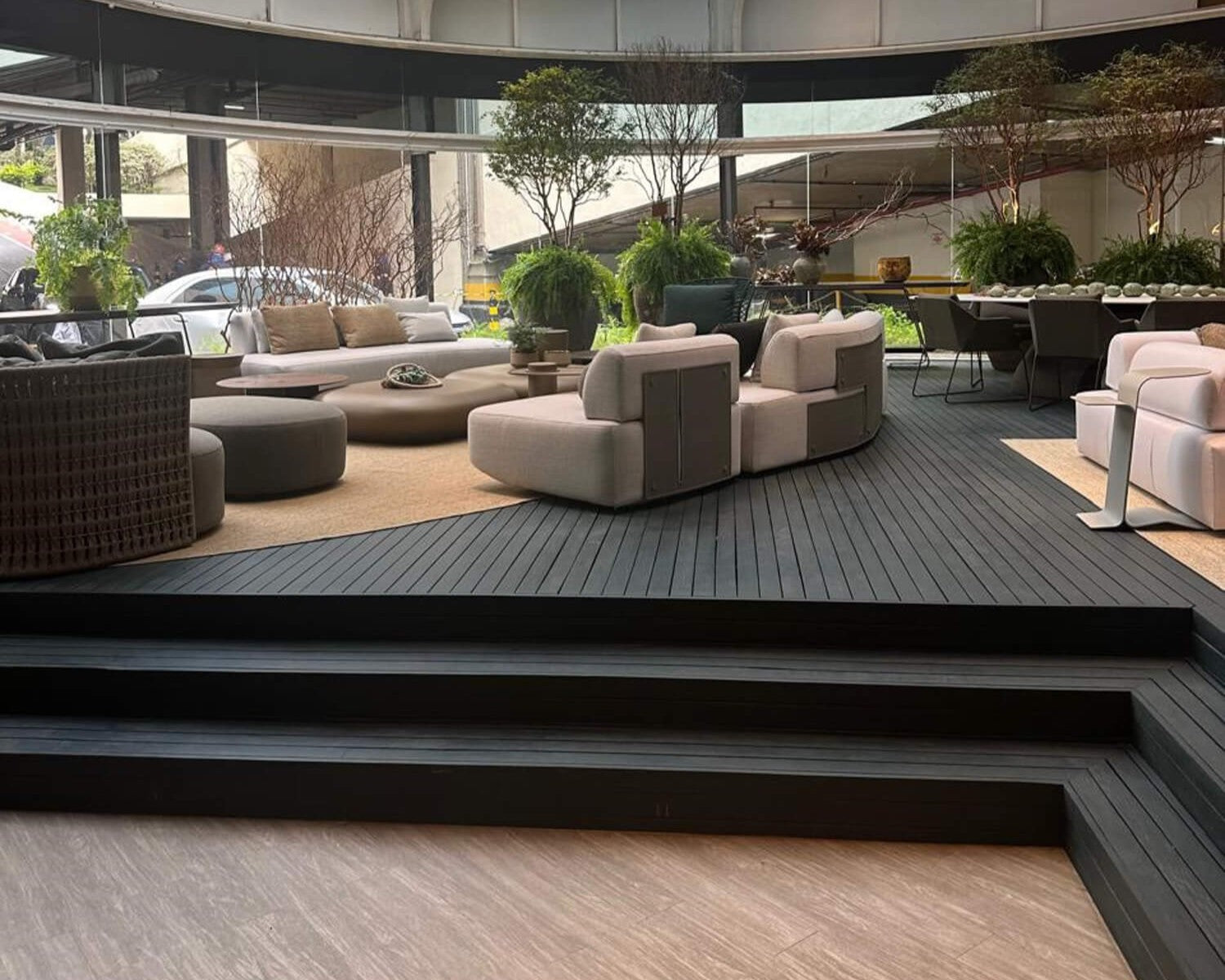Project inspiration for a dark green wood deck. This deck is a part of a home furnishing store in Brazil. It was crafted from cumaru and finished with DuroGrit exterior wood stain and sealer in one.