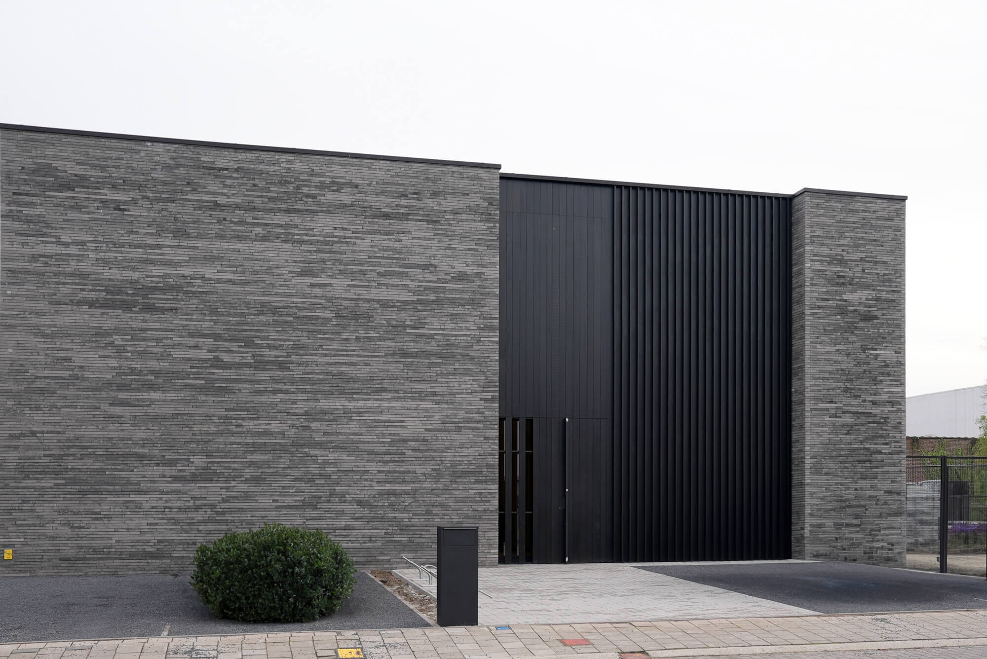 Exterior project inspiration for modern wood cladding. Fraké wood was used for this siding and it was finished with DuroGrit 