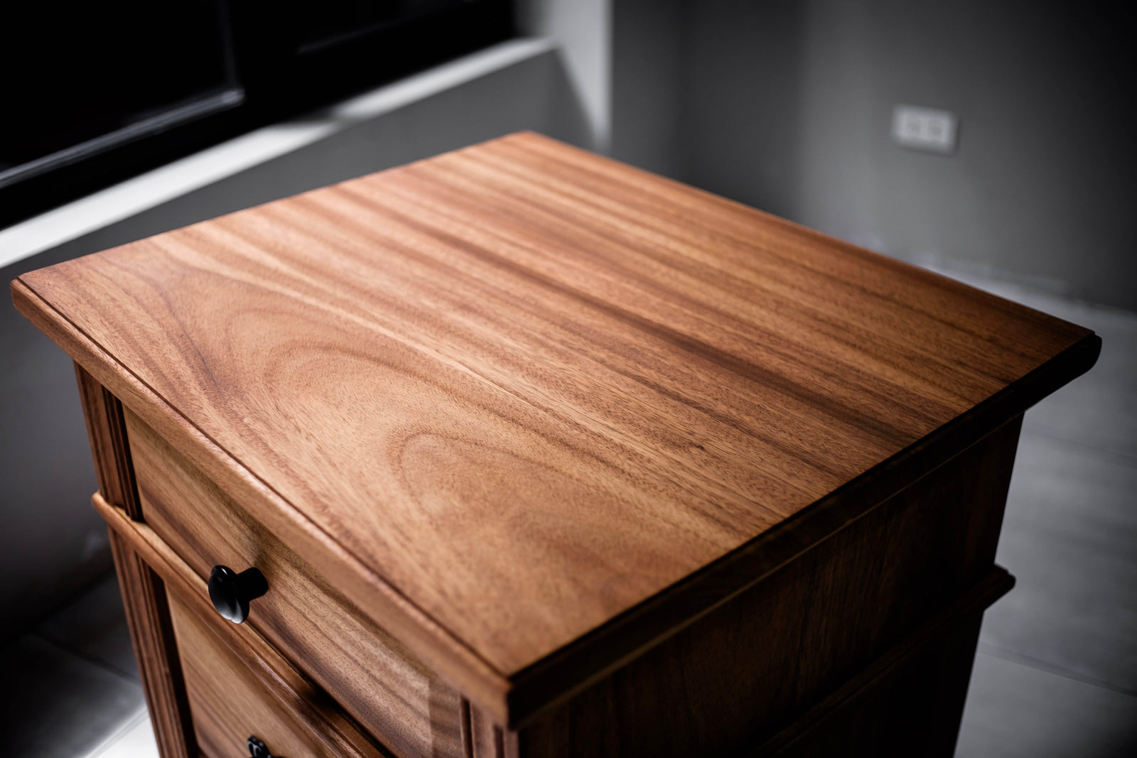 Natural wood surfaces with visible grain and a low-sheen finish