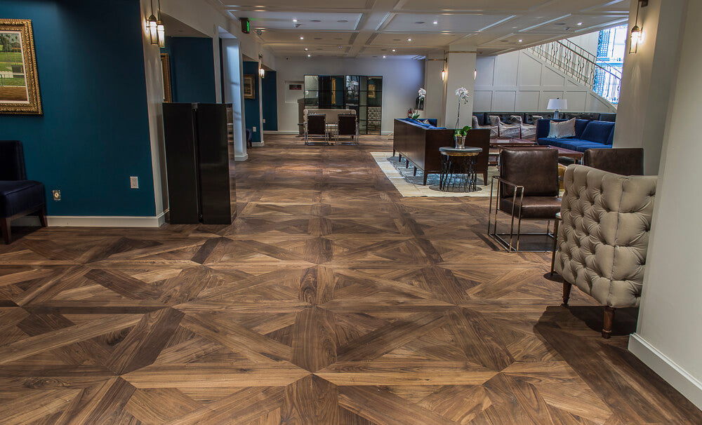 Elegant walnut wood flooring in a horse race track lounge.