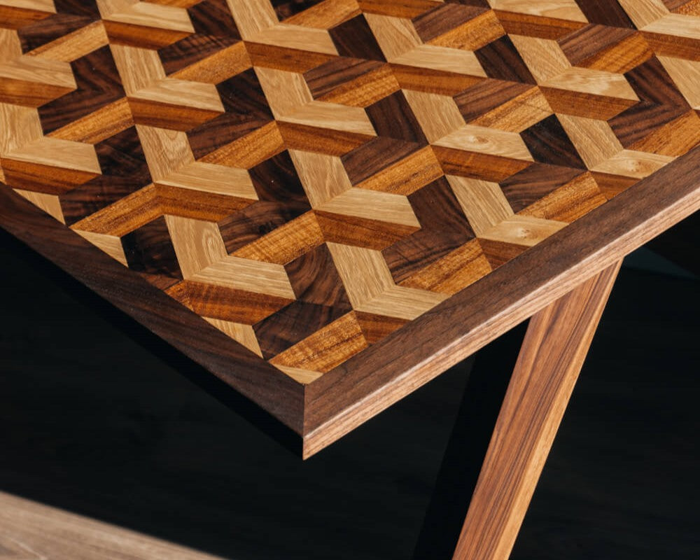 A walnut desk with an interesting geometric inlay finished using Rubio Monocoat Oil Plus 2C hardwax oil wood finish.
