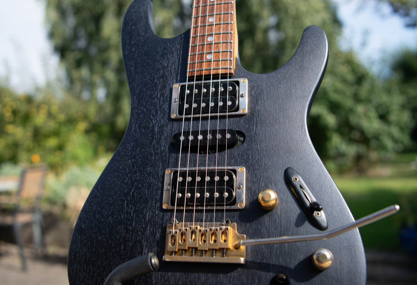 Guitar renovation inspiration featuring a mahogany Ibanez treated with Rubio Monocoat Precolor Easy and finished with Oil Plus 2C interior hardwax oil wood stain and finish in one coat.