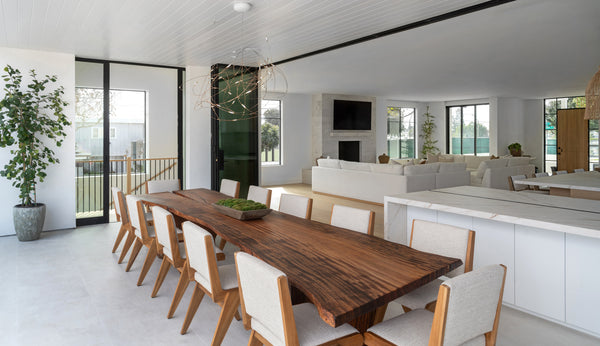 A massive monkeypod dining table finished with Oil Plus 2C hardwax oil wood finish for interior furniture