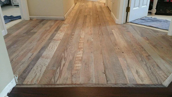 The 2017 NWFA Wood Floor of the Year Winner in the Restoration and Renovation category. It is reclaimed barnwood flooring finished with Oil Plus 2C in the color "white".