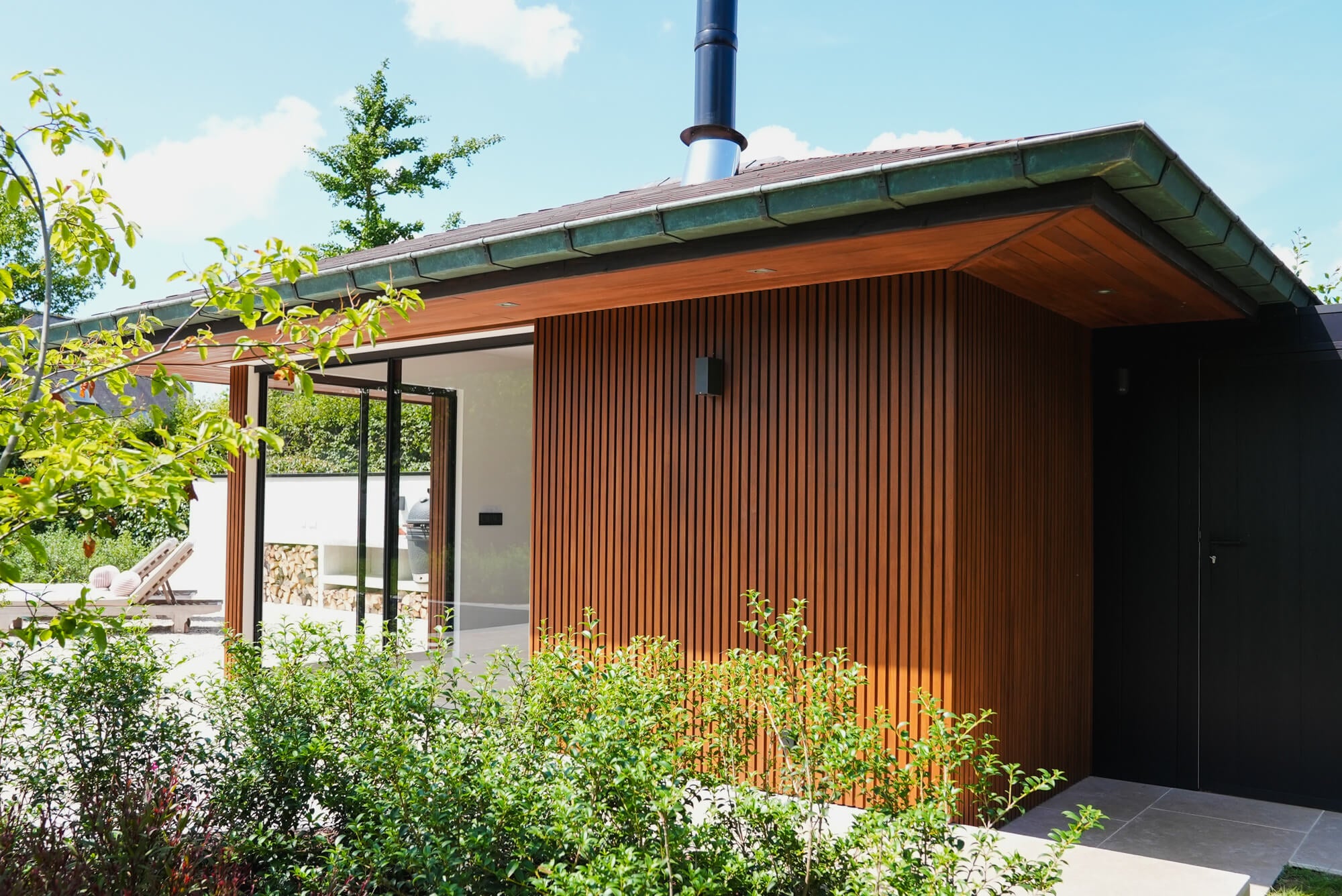 An outdoor wood pool house finished with Rubio Monocoat's DuroGrit exterior wood finish.