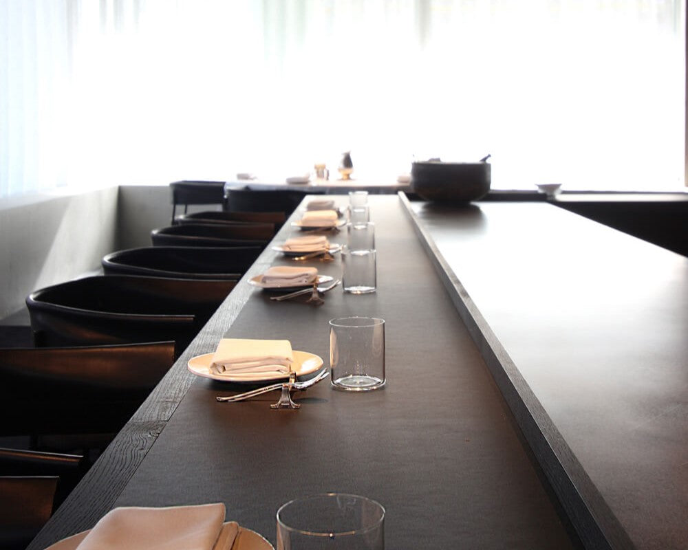 A commercial restaurant with tables finished with Rubio Monocoat products to create a durable, opaque black finish.