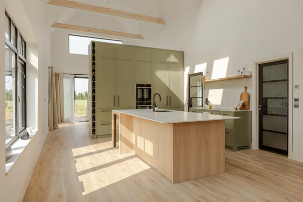 Project inspiration for a modern kitchen with a pop of color and contrasting wood details. The oak veneer island and floating shelves were finished with Oil Plus 2C "Smoke" hardwax oil wood stain and finish for interior wood surfaces. 