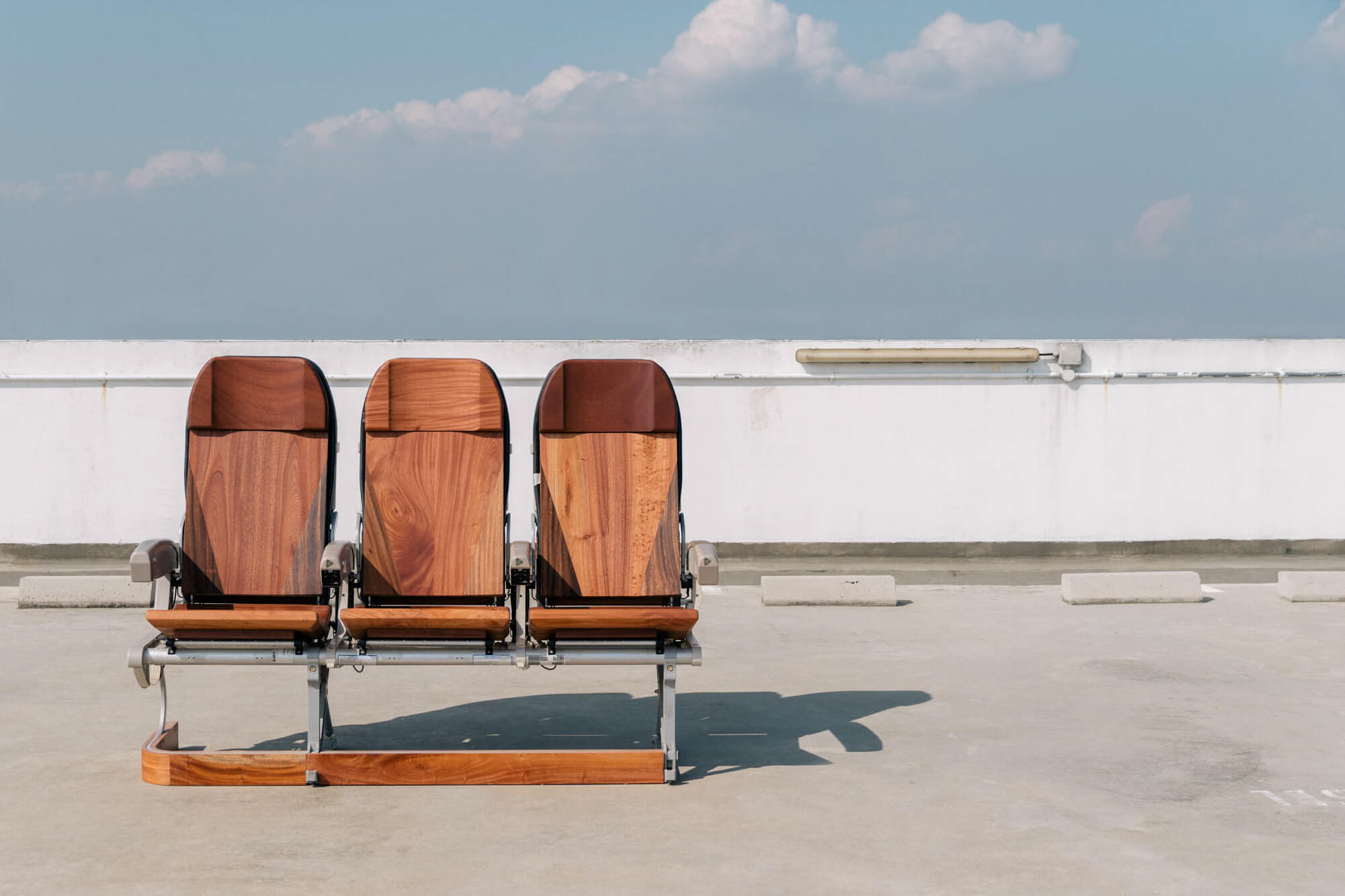 Three recycled Singapore Airlines seats covered in African Mahogany and finished with Rubio Monocoat Oil Plus 2C hardwax oil wood finish.