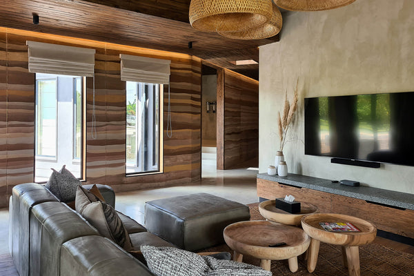 A safari-inspired home filled is filled with natural-inspired design elements that pay homage to an African minimalist lodge style. The European Oak in the home was finished with Oil Plus 2C "Black" to add to the rustic feel. 