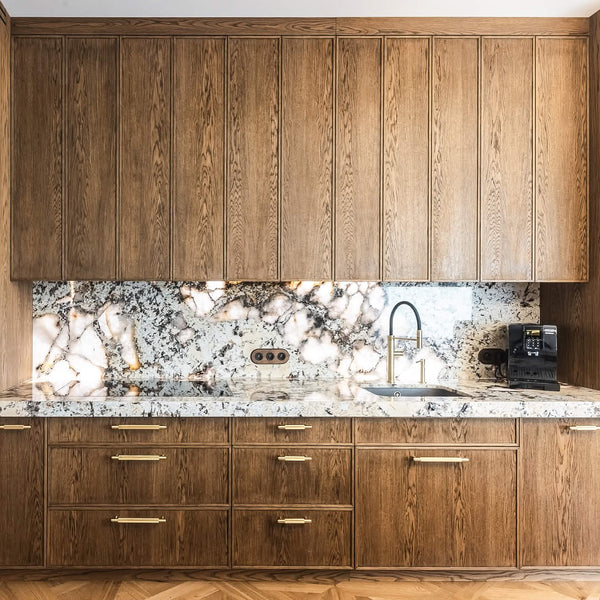 Kitchen inspiration for a warm minimalist look with oak cabinetry finished with Rubio Monocoat Oil Plus 2C "Chocolate". 