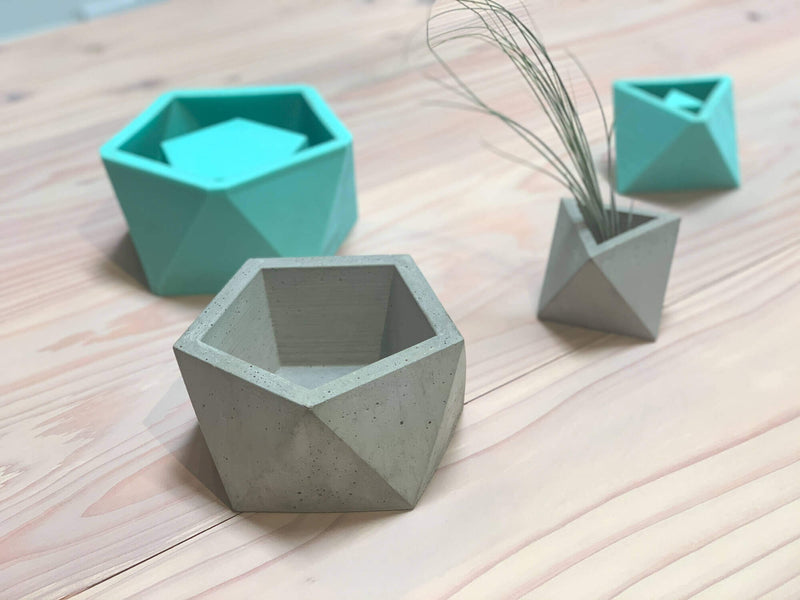 Geometric objects sitting on a redwood retail display finished with a hardwax oil based wood finish.