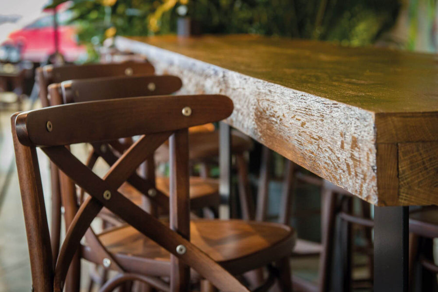 Natural wood finish from Rubio Monocoat used to protect restaurant tables and chairs.
