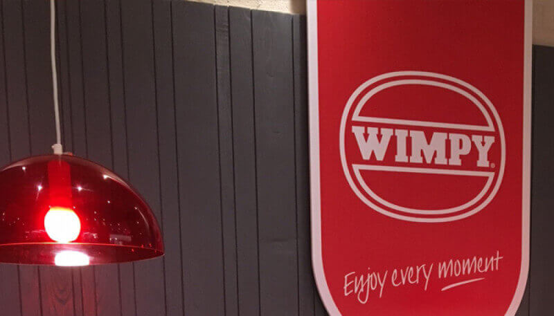 A wood wall at Wimpy food chain that is finished with hardwax oil wood finish.