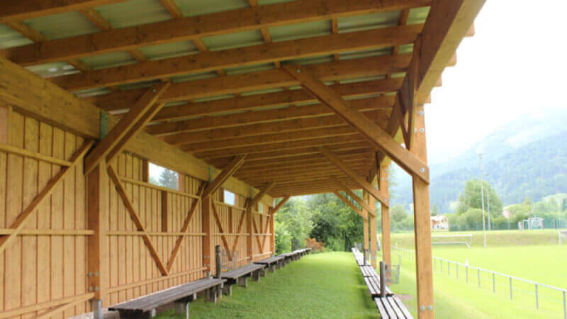 A wooden covering for outdoor gatherings.