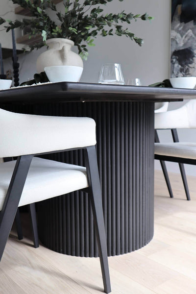 A detail shot of one of the fluted bases on a black white oak dining table finished with Rubio Monocoat Precolor Easy and Oil Plus 2C.