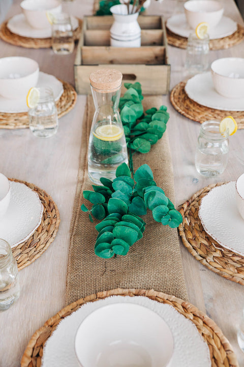 Place settings on a white oak table finished with Rubio Monocoat Oil Plus 2C "Super White" hardwax oil wood stain and finish for interior wood projects.