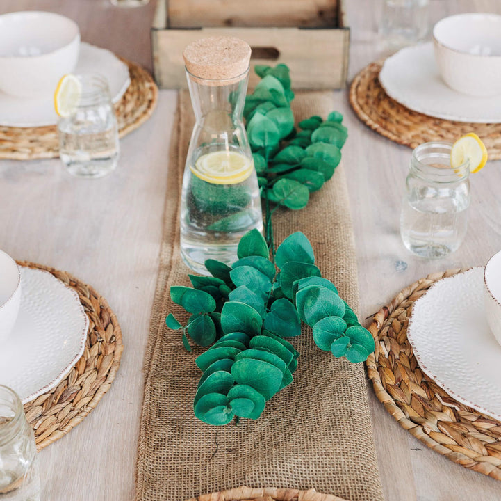 Several place settings and a table runner on a custom white oak dining table finished with Oil Plus 2C.