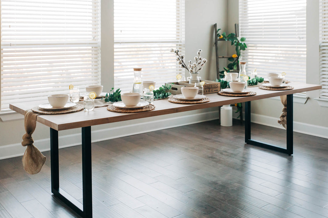 A handmade white oak table with seating for eight finished with Rubio Monocoat Oil Plus 2C hardwax oil wood stain and finish.