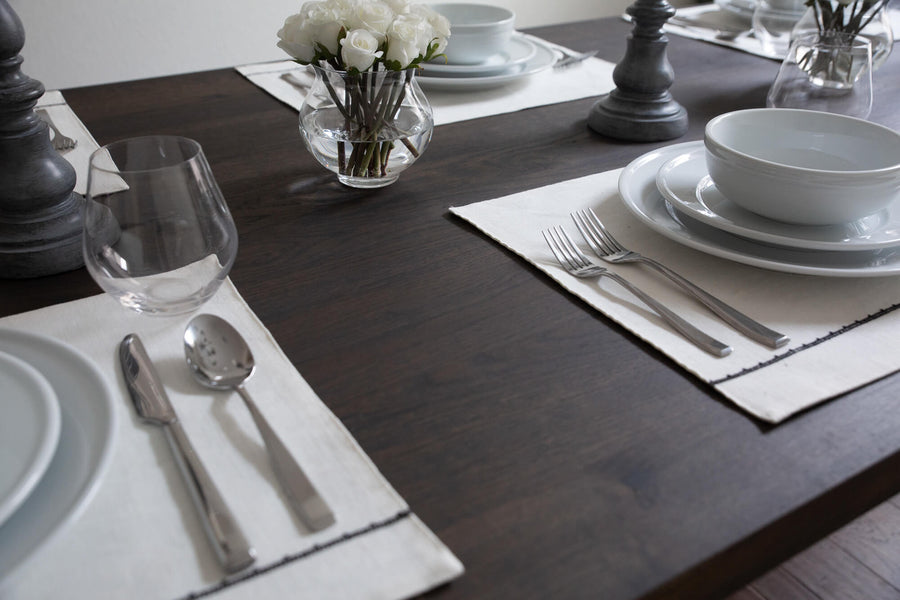 Place settings on a white oak table finished with Rubio Monocoat Oil Plus 2C "Charcoal".