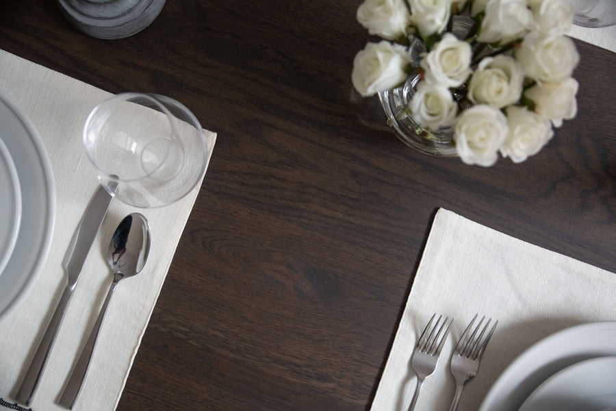 A white oak table finished with a bold, dark finish.