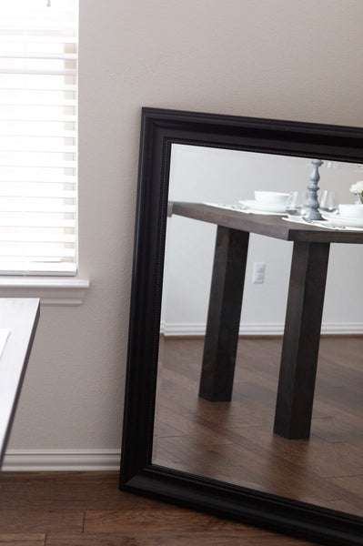 A white oak table finished with a bold, dark finish.
