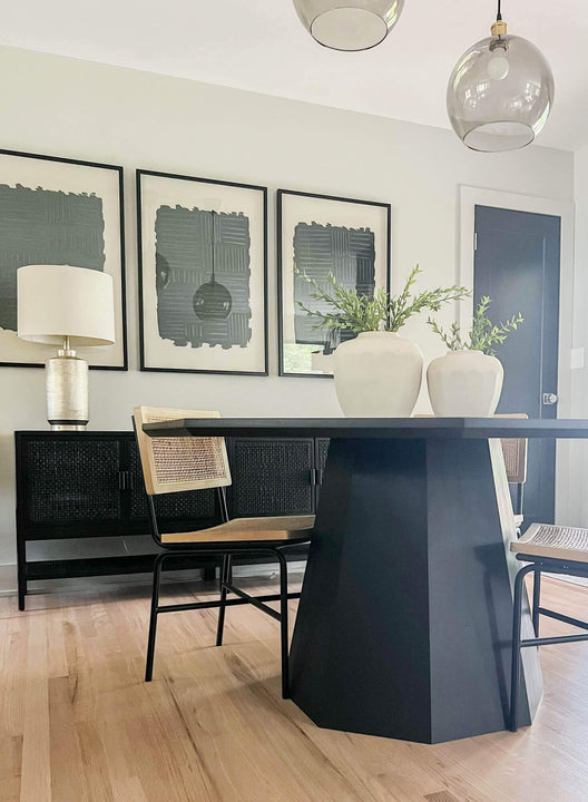 A maple octagon shaped table with cane chairs.