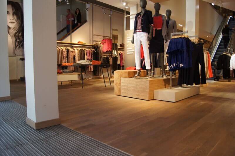 Clothing store with durable hardwood flooring.
