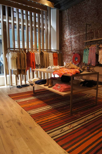 Clothing store with durable hardwood flooring.
