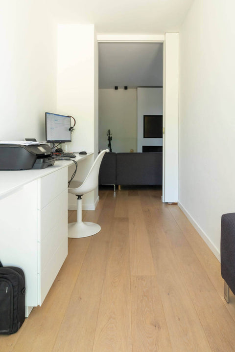Hallway features wood floors finished with Rubio Monocoat.