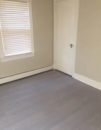 A Red Oak hardwood floor that was finished using Oil Plus 2C in the color Ash Grey.