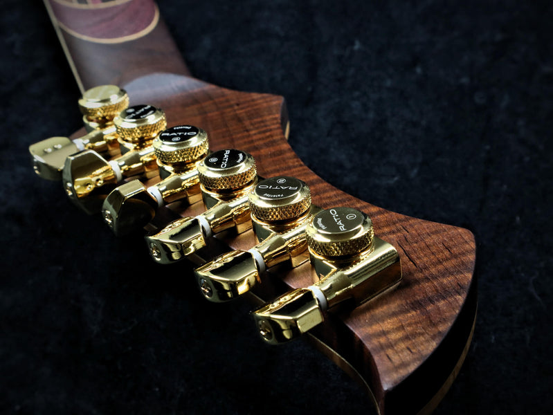 Gold tuning keys on the back of the guitar