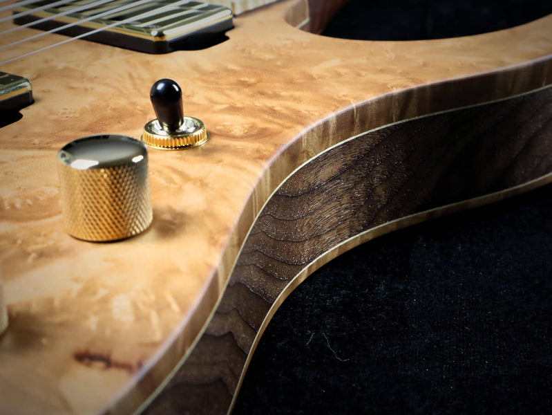 A close up of the side details and hardware on this custom built guitar.