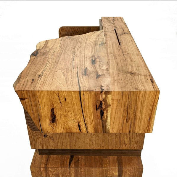 Live edge detail on a console crafted from walnut, pecan and white oak.