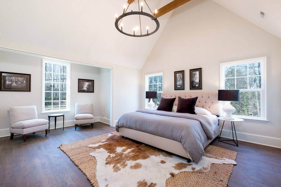 Master bedroom with white oak hardwood flooring finished with an eco-friendly hardwood floor finish.