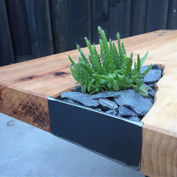 Unique stone detail on wooden table finished with Rubio Monocoat Oil Plus 2C.