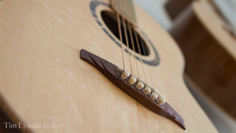 A birdseye maple acoustic guitar finished with Oil Plus 2C wood finish.