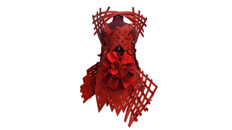 Front profile of a red dress made out of wood strips.