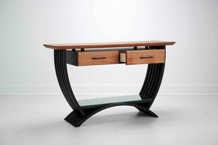 Angled view of a curvy console table finished with Rubio Monocoat hardwax oil wood finish.